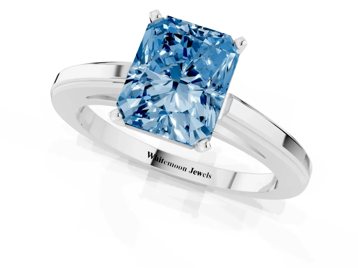Fancy Blue Radiant Cut Solitaire Diamond Ring with Four-Prong Setting and Classic Band Platinum