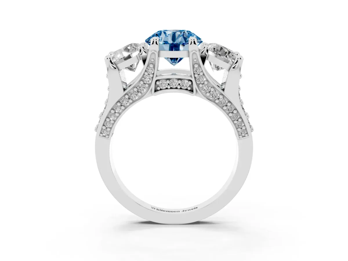 Fancy Blue Round Cut Diamond Three-Stone Ring with Channel Set Band and Four-Prong Setting Silver