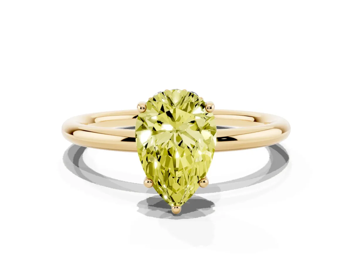 Fancy Yellow Pear Cut Solitaire Diamond Ring with a Classic Band and Four-Prong Setting Yellow gold