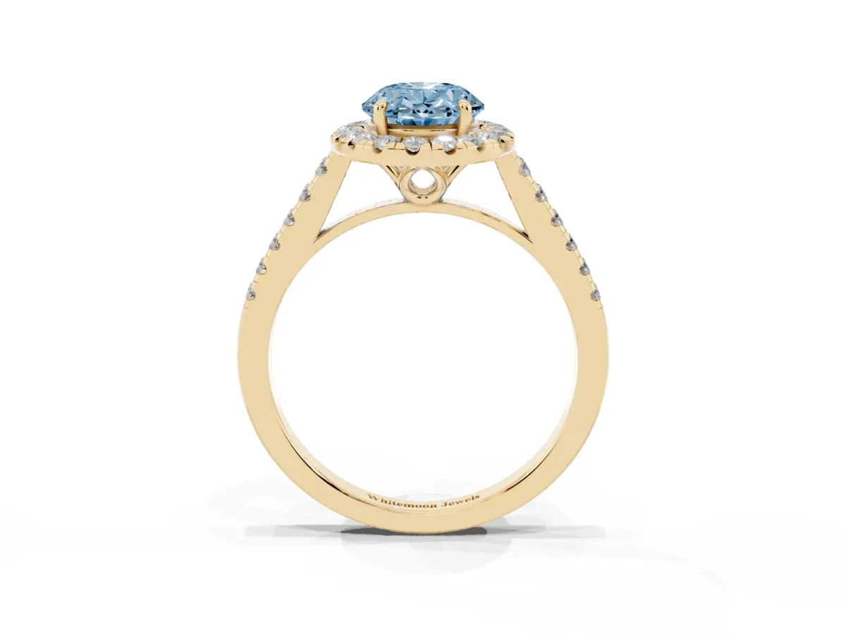 Fancy Blue Oval Cut Halo Pavé Diamond Engagement Ring with Four-Prong Setting Yellow gold