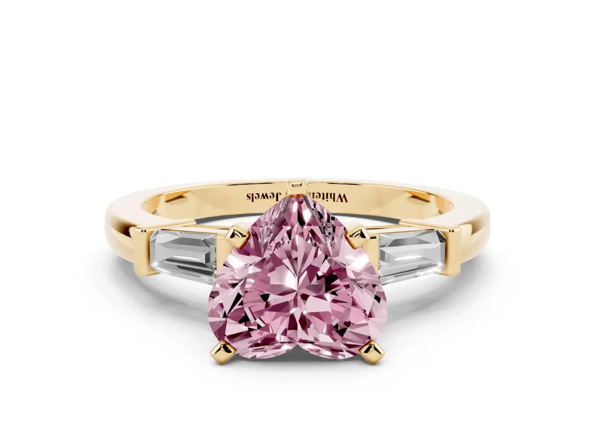 Fancy Pink Heart Cut Cut Diamond Solitaire Ring with Tapered Baguette Accents and Four-Prong Setting Yellow gold