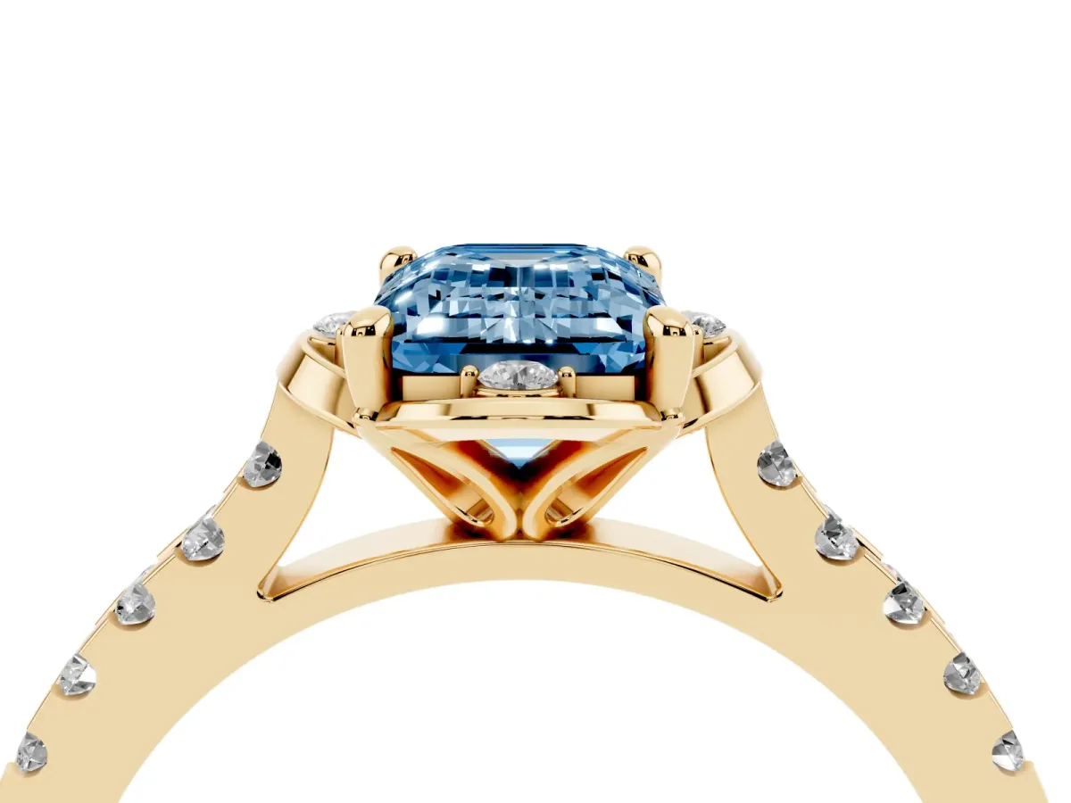 Fancy Blue Emerald Cut Diamond Ring with Pavé Band and Floral Prong Setting Yellow gold