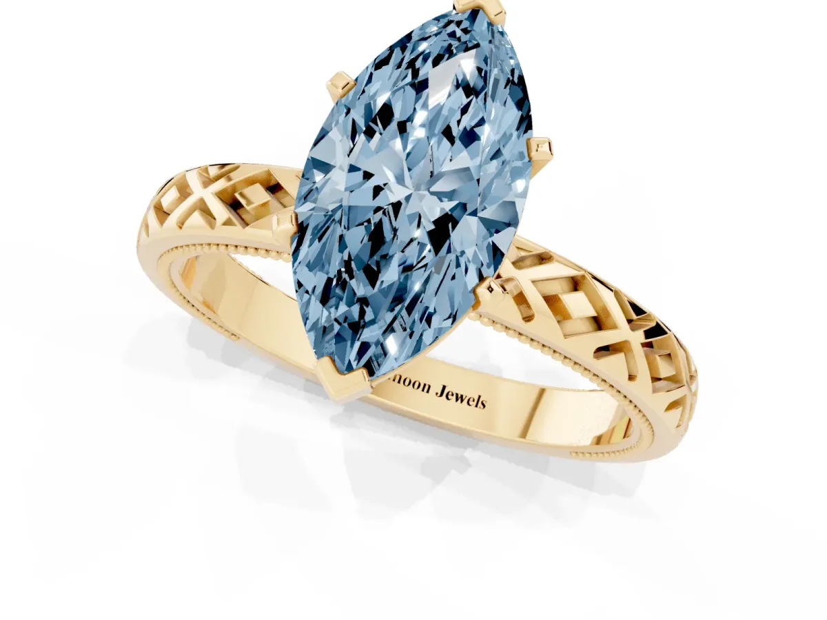 Fancy Blue Marquise Cut Solitaire Diamond Ring with Milgrain and Black Enamel X Pattern Band Yellow gold