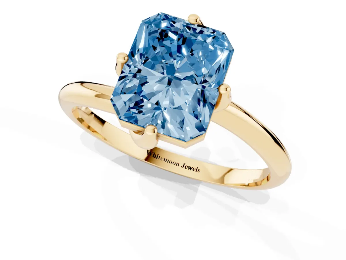 Fancy Blue Radiant Cut Diamond Solitaire Engagement Ring with Four-Prong Setting and Classic Band Yellow gold