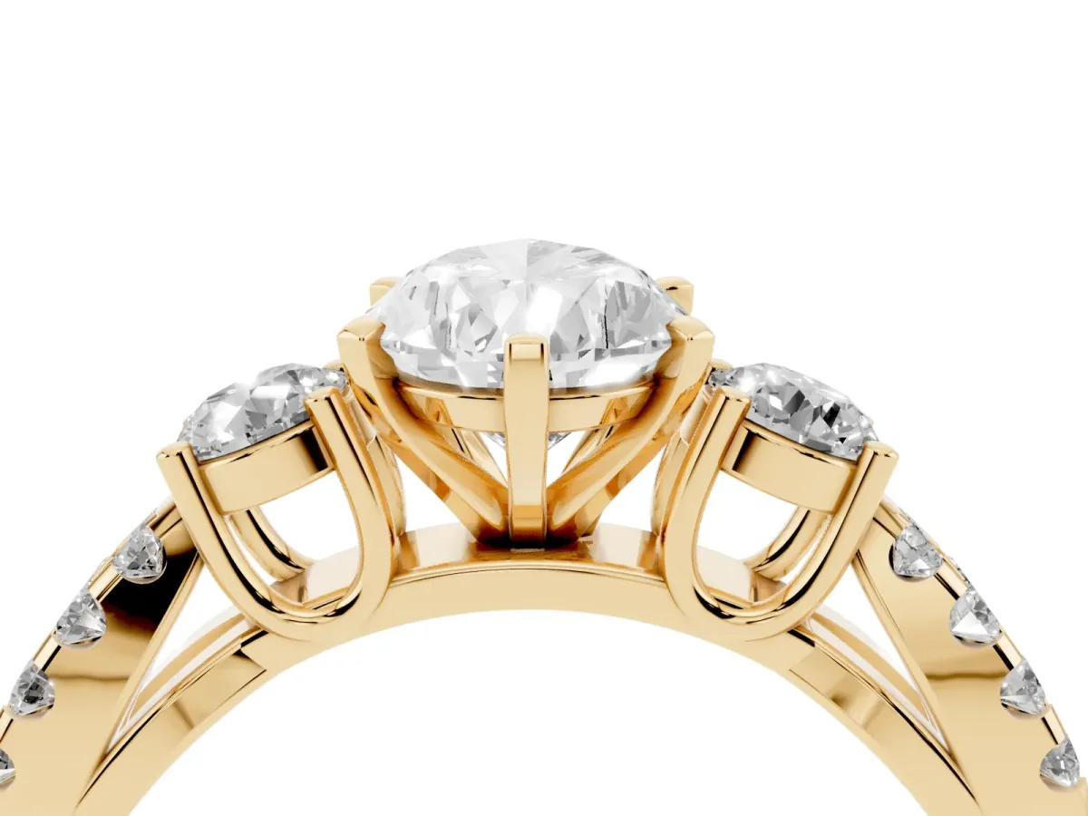 Pear Cut Diamond Three-Stone Ring with Pavé Split Shank and Four-Prong Setting Yellow gold