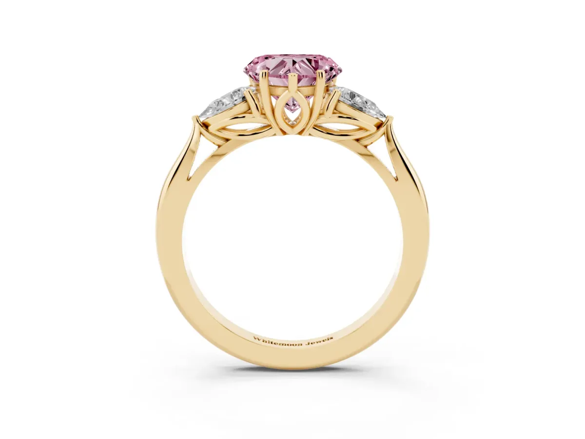 Fancy Pink Three-Stone Heart Cut Diamond Ring with Pear Side Stones in Four-Prong Setting Yellow gold