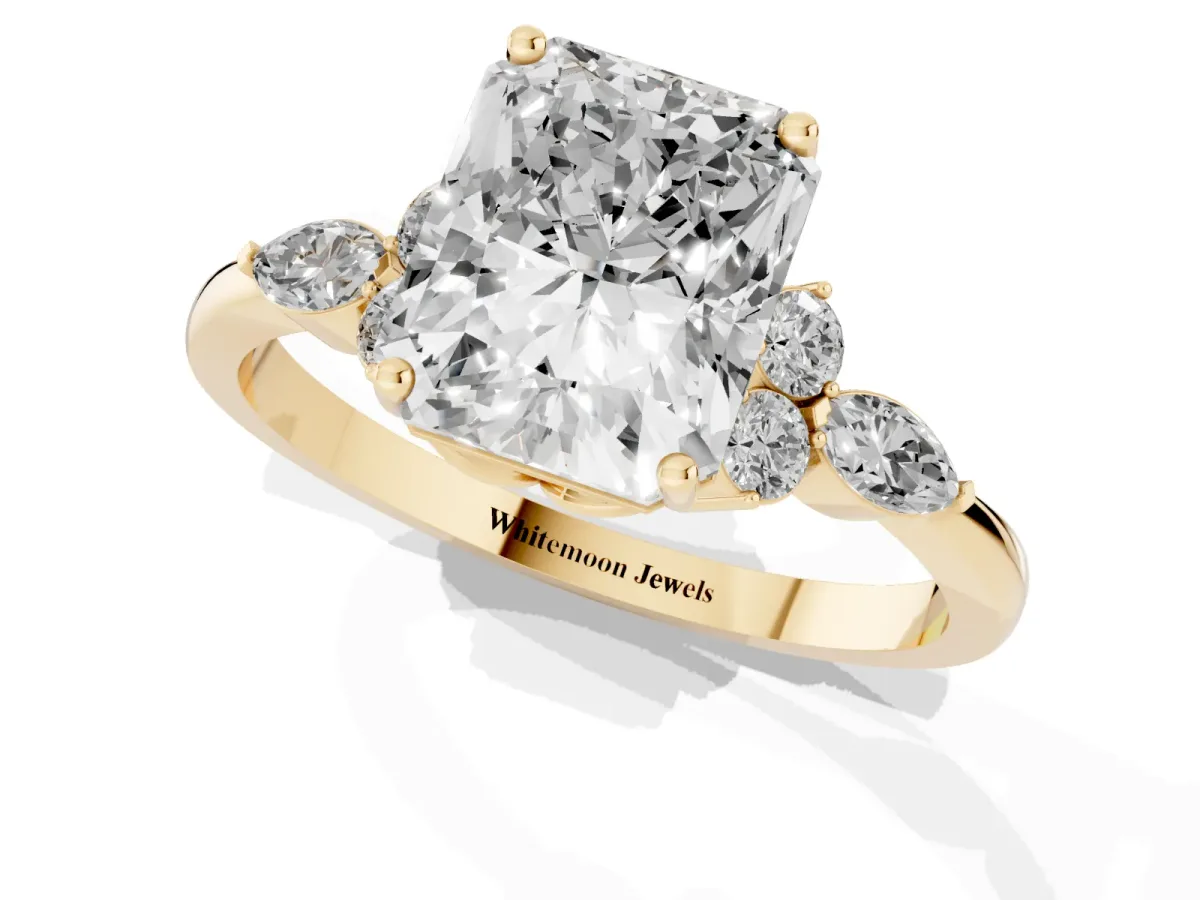 Radiant Cut Brilliant Diamond Solitaire Ring with Pear Side Stones and Four-Prong Setting Yellow gold