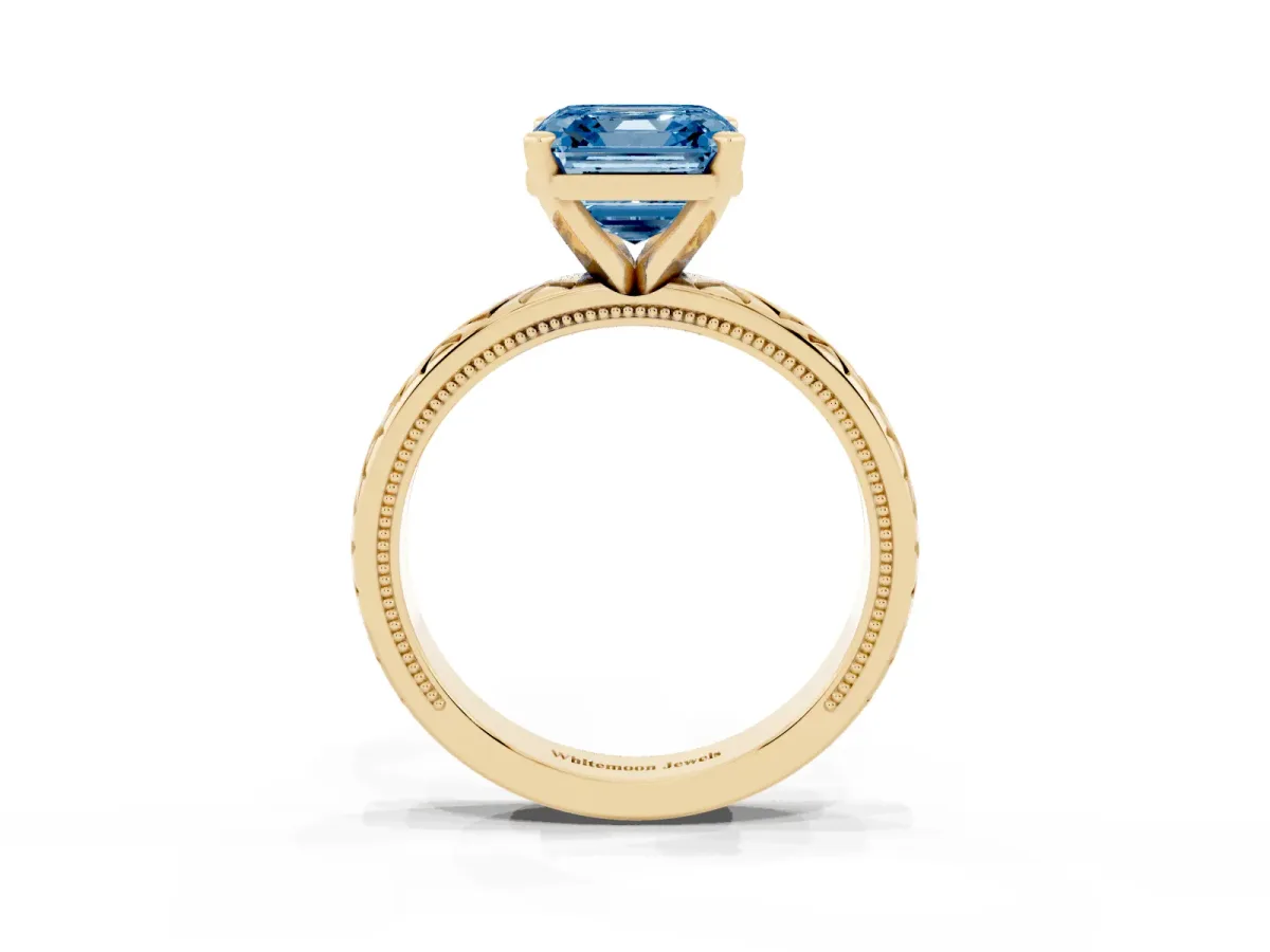 Fancy Blue Asscher Cut Solitaire Diamond Ring with Milgrain and Black Enamel X Pattern Band Yellow gold