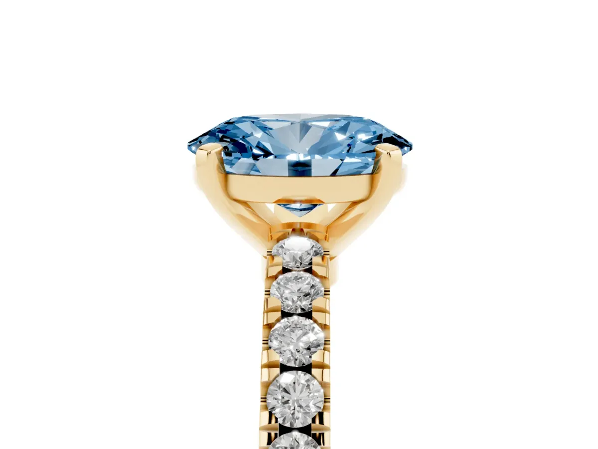 Fancy Blue Oval Cut Solitaire Diamond with Pavé Band and Four-Prong Setting Yellow gold