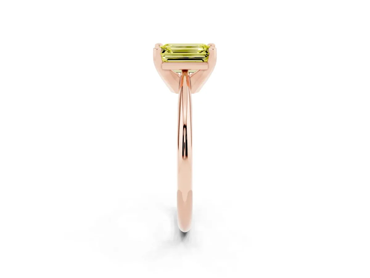Fancy Yellow Emerald Cut Cut Solitaire Ring with Four-Prong Setting on a Classic Band Rose gold