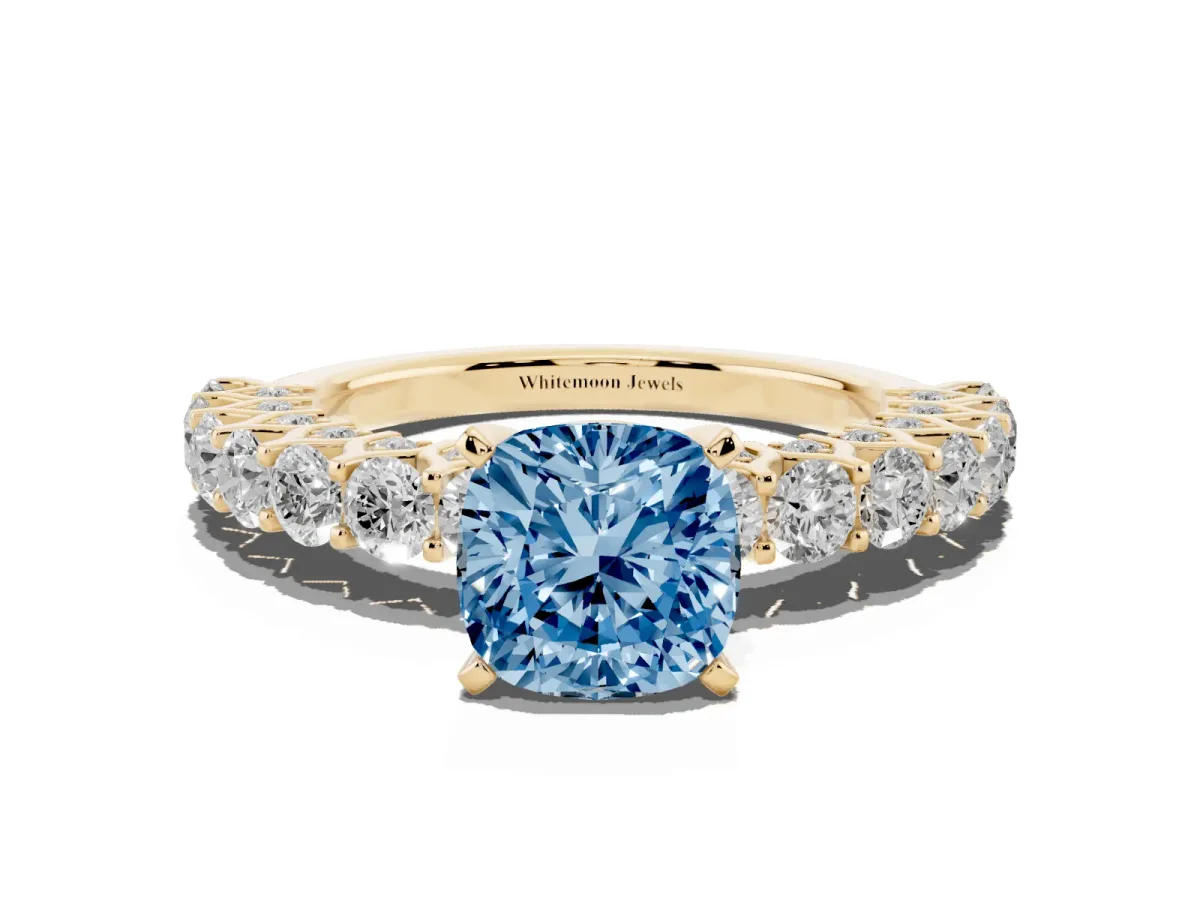 Fancy Blue Cushion Cut Diamond Solitaire Ring with Shared Prong Pavé Band and Four-Prong Setting Yellow gold