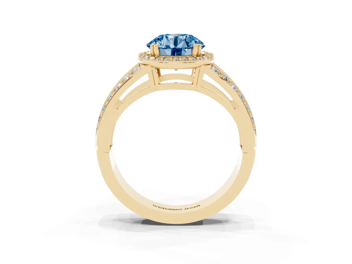 Fancy Blue Round Cut Diamond Halo Ring with Split Shank Pavé Band and Four-Prong Setting Yellow gold