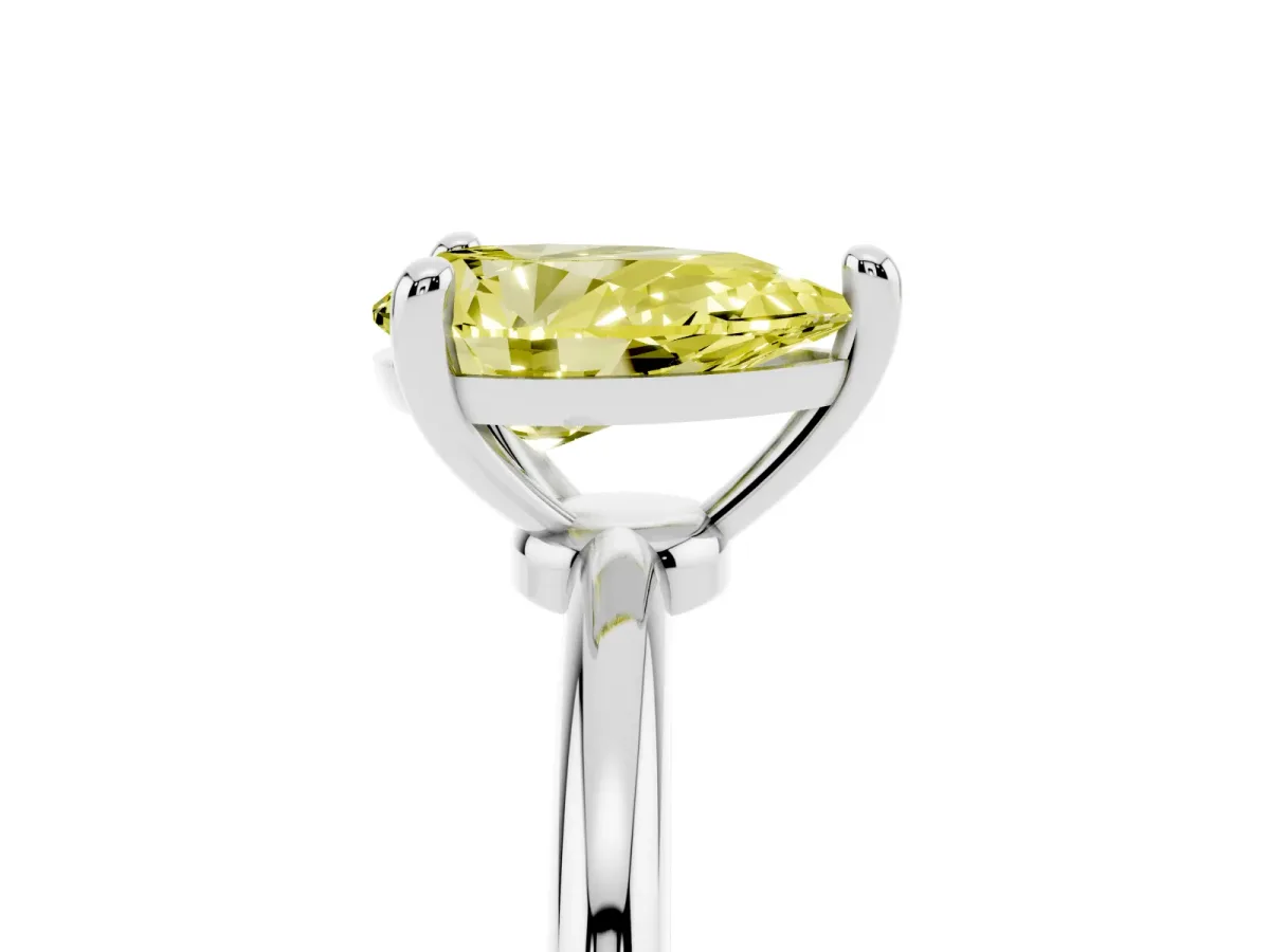 Fancy Yellow Pear Cut Solitaire Diamond Ring with 4-Prong Setting on a Classic Band Silver