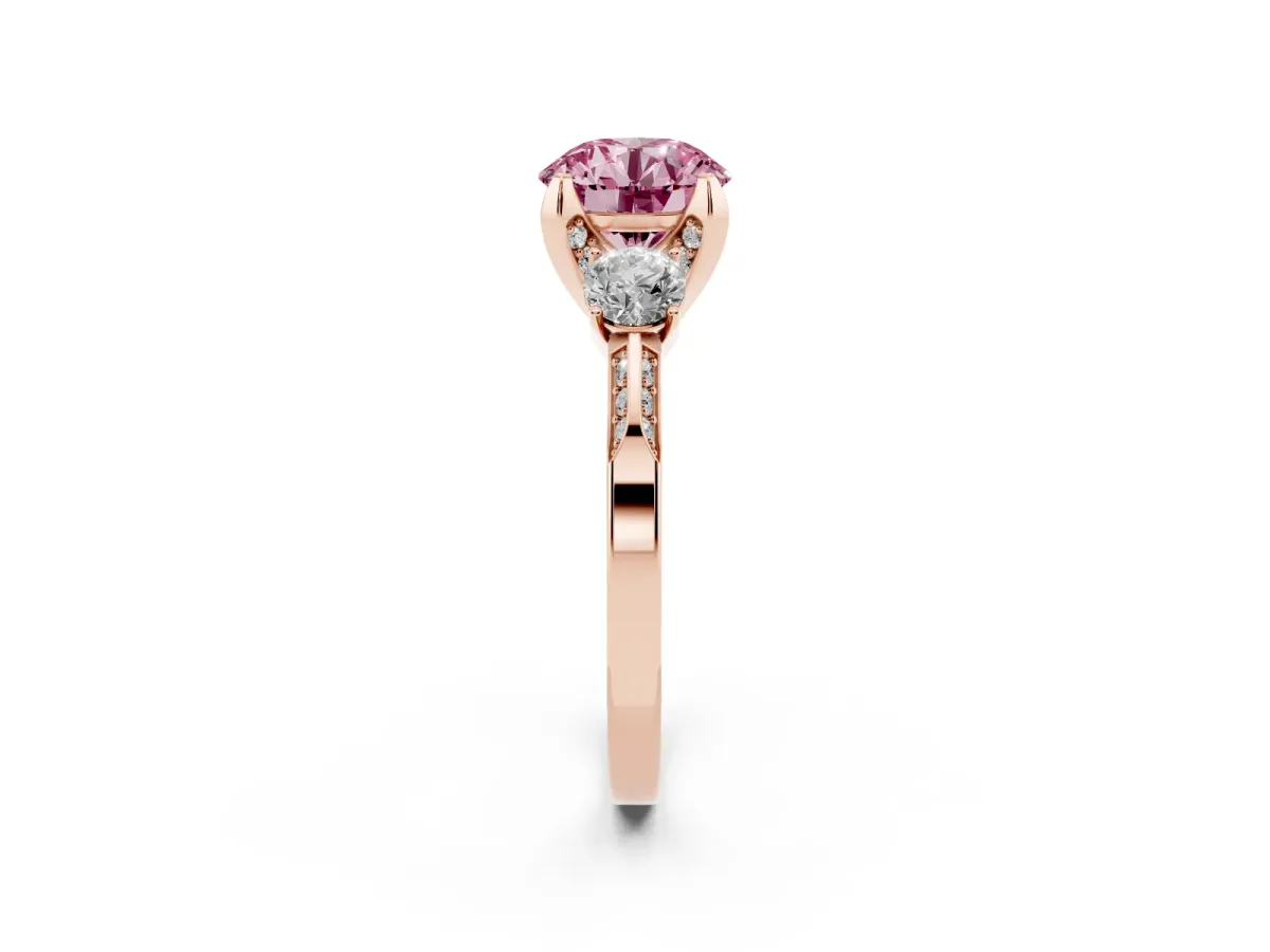 Fancy Pink Round Cut Brilliant Three-Stone Diamond Ring with Pavé Band and Four-Prong Setting Rose gold