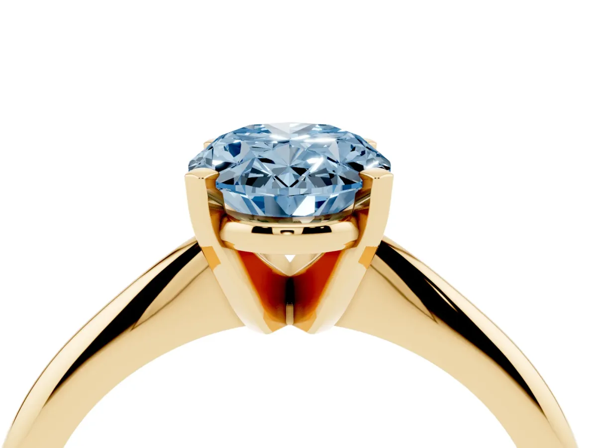 Fancy Blue Oval Cut Cut Solitaire Ring with Four-Prong Setting on a Classic Band Yellow gold