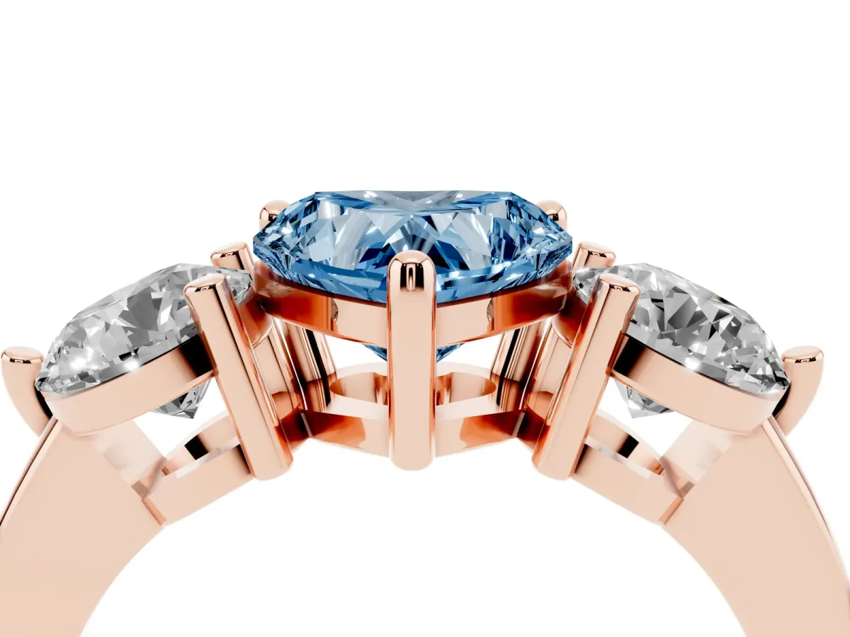 Fancy Blue Three-Stone Heart Cut Brilliant Cut Solitaire Ring with Prong Setting on a Classic Band Rose gold