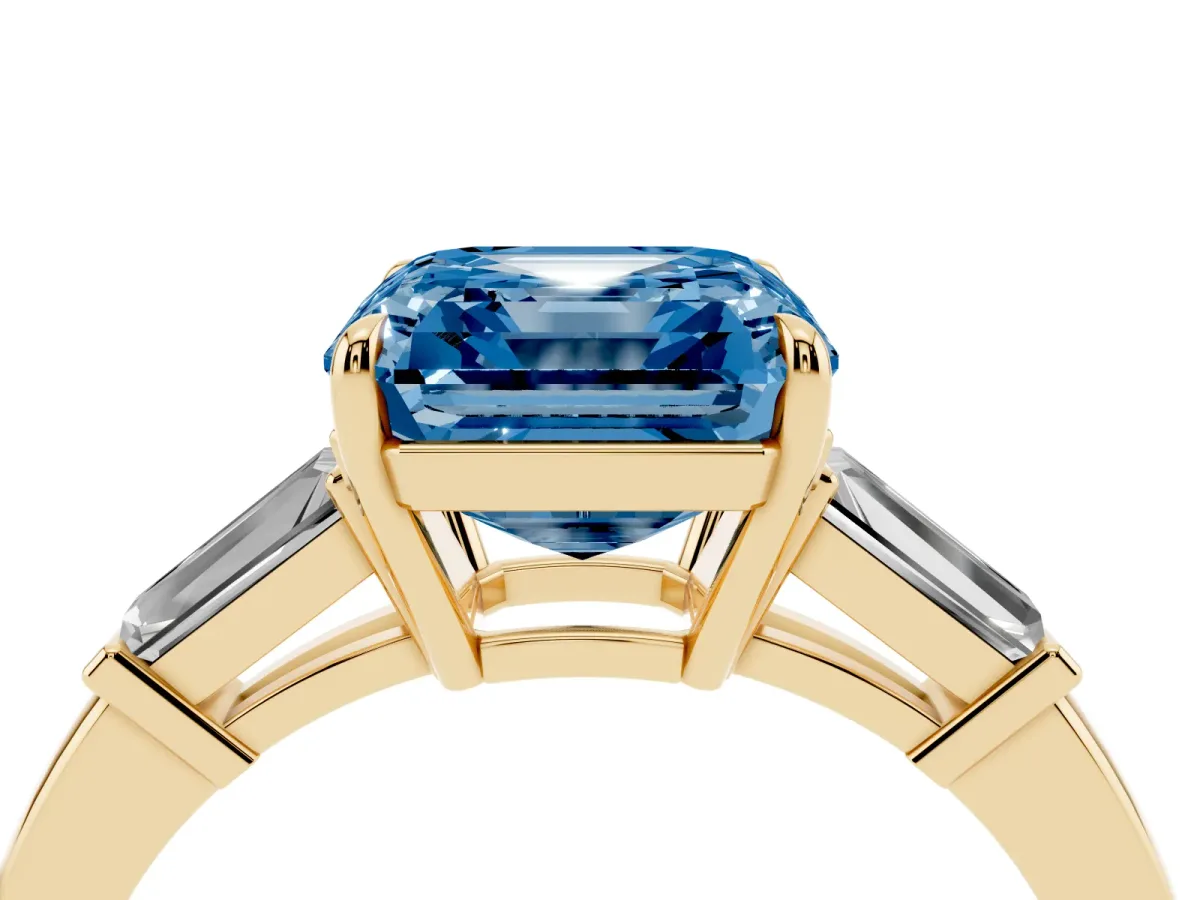 Fancy Blue Asscher Cut Diamond Three-Stone Ring with Tapered Baguette Side Stones and Prong Setting Yellow gold
