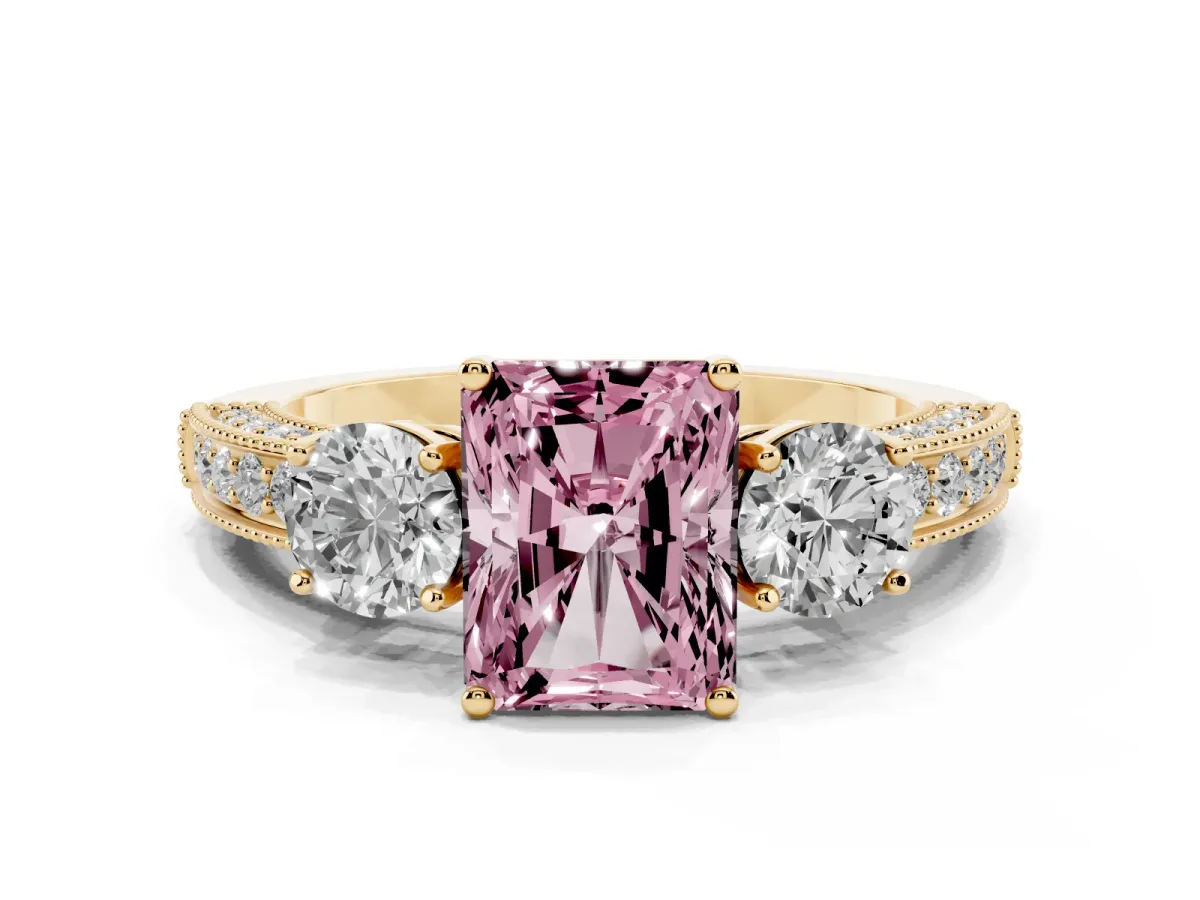 Fancy Pink Radiant Cut Three-Stone Diamond Ring with Pavé Band and Four-Prong Setting Yellow gold