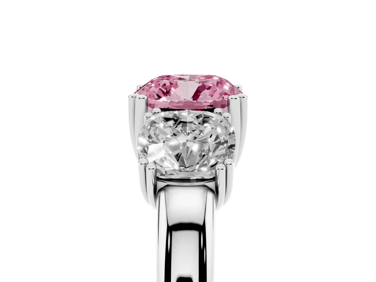 Fancy Pink Three-Stone Cushion Cut Cut Diamond Ring with Channel Set Band and Four-Prong Setting Platinum