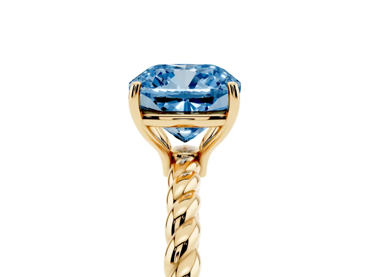 Fancy Blue Cushion Cut Solitaire Twist Band Ring with Four-Prong Setting Yellow gold