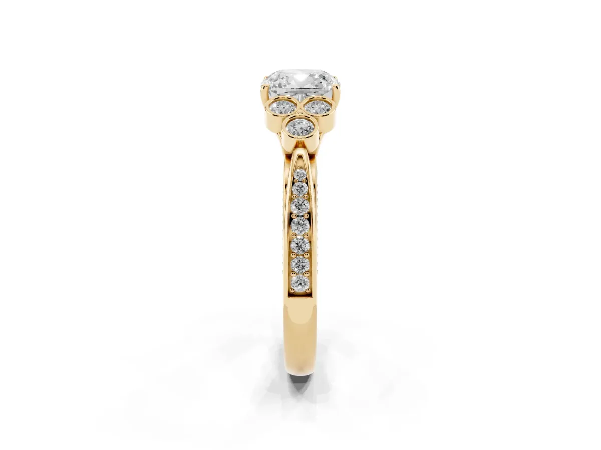 Cushion Cut Cut Diamond Engagement Ring with Bezel Set Round Side Stones and Prong Setting Yellow gold