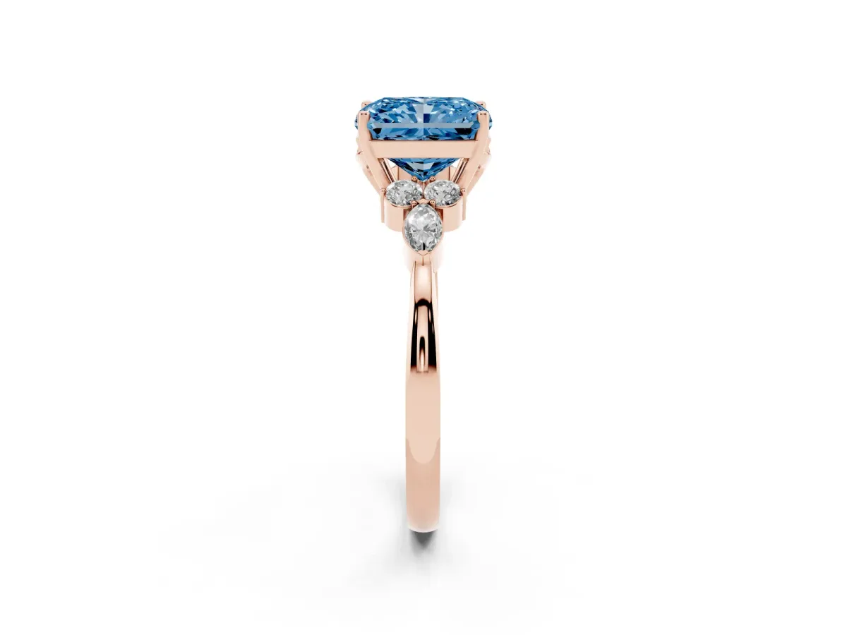 Fancy Blue Radiant Cut Brilliant Diamond Solitaire Ring with Pear Side Stones and Four-Prong Setting Rose gold