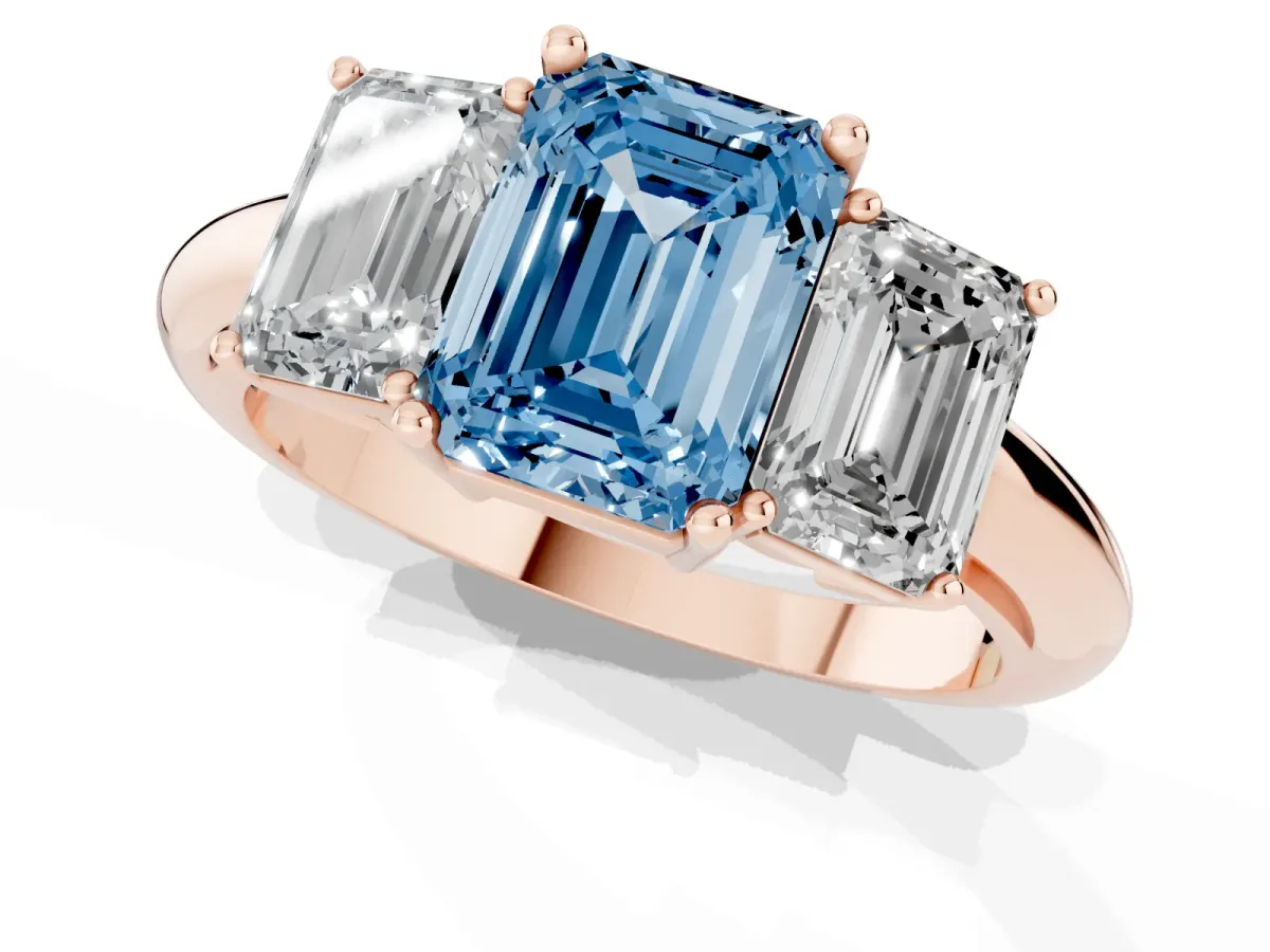 Fancy Blue Three-Stone Emerald Cut Cut Diamond Engagement Ring with Prong Setting on a White Gold Band Rose gold