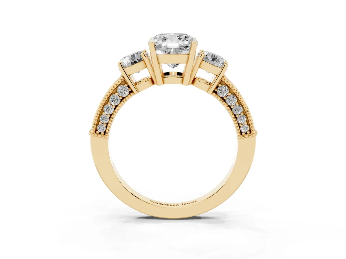 Cushion Cut Three-Stone Diamond Ring with Pavé Band and Four-Prong Setting Yellow gold