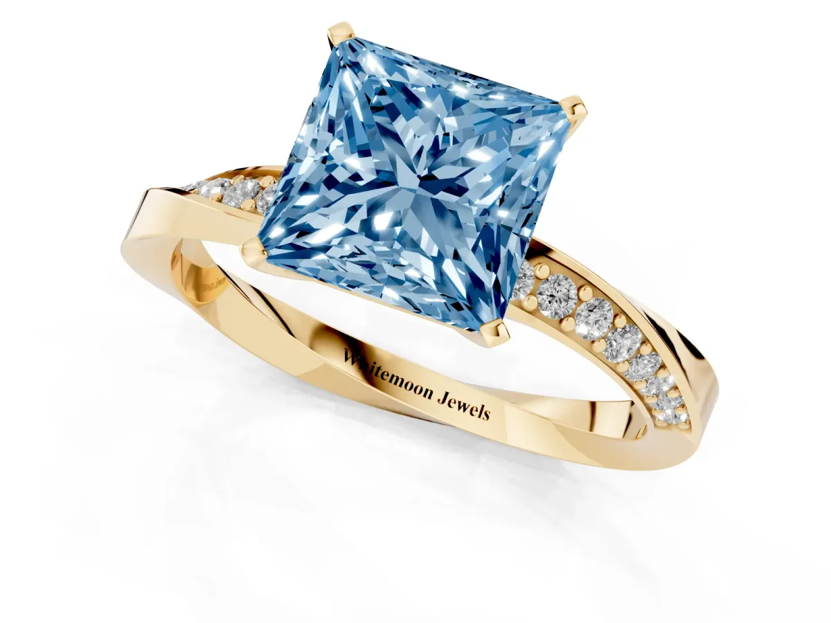 Fancy Blue Princess Cut Diamond Engagement Ring with Side Stone Accents and Four-Prong Setting Yellow gold