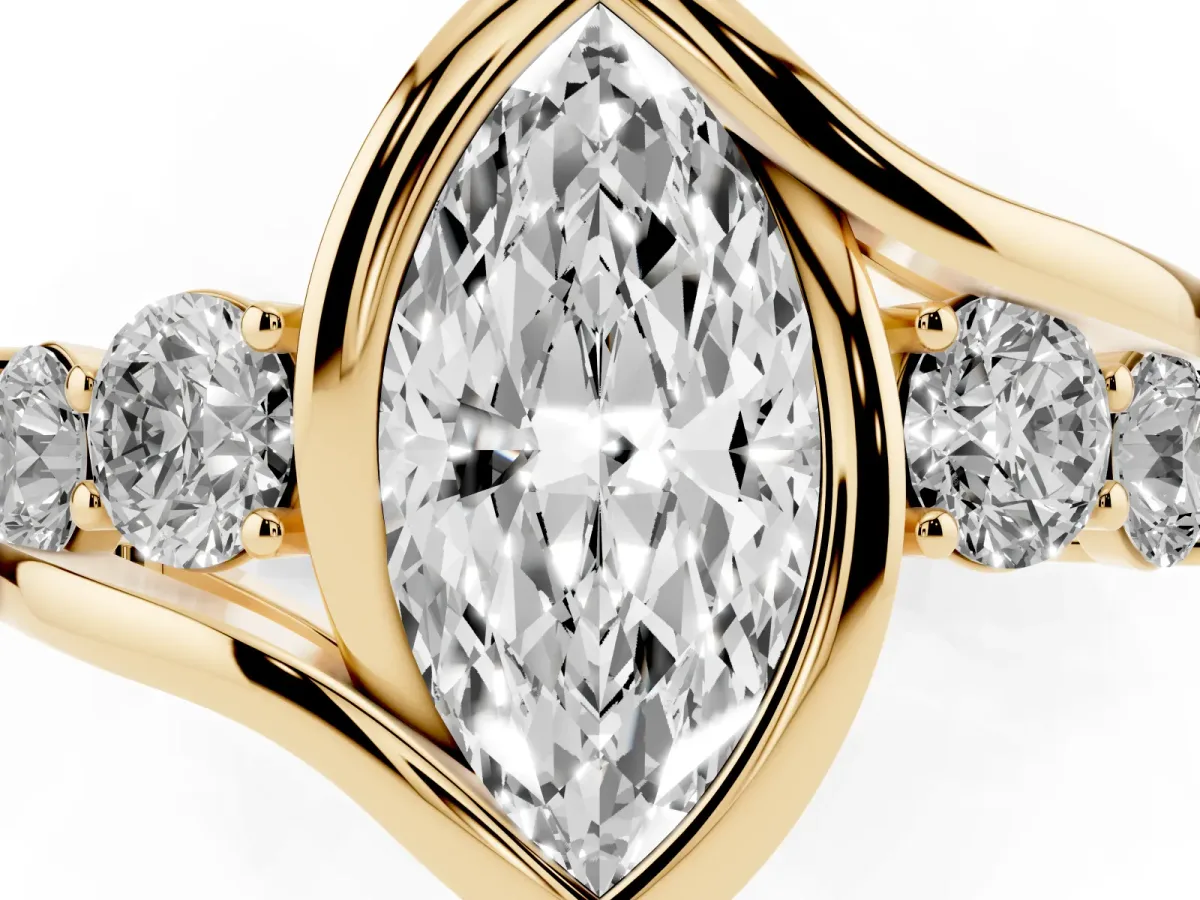 Bezel Set Marquise Cut Diamond Bypass Ring with Round Accents Yellow gold