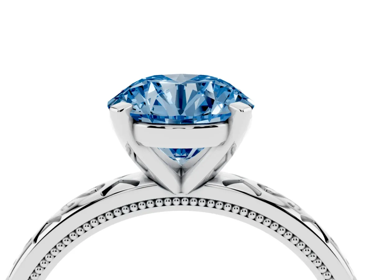 Fancy Blue Round Cut Solitaire Engagement Ring with Scrollwork Band and Four-Prong Setting Silver