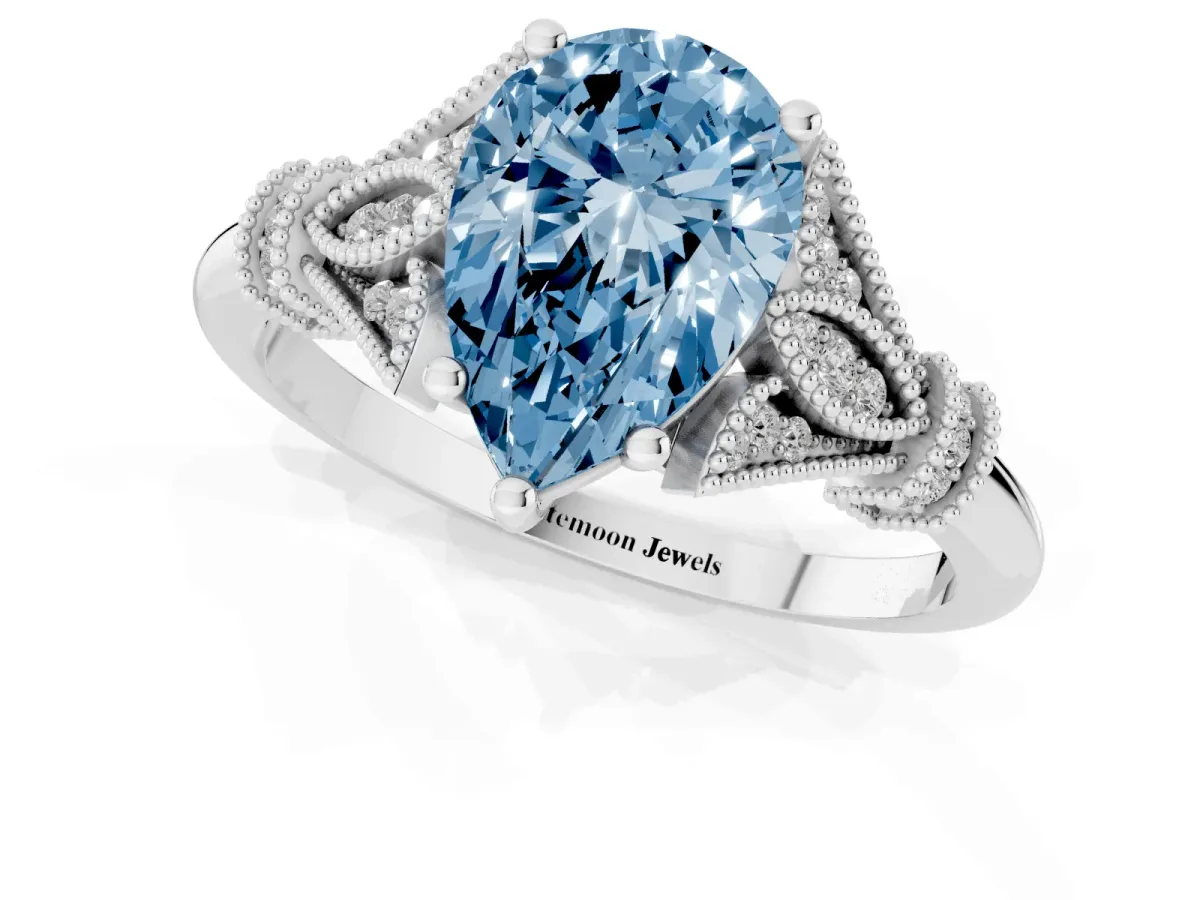 Fancy Blue Pear Cut Diamond Solitaire Ring with Floral Filigree and Pave Accents Silver