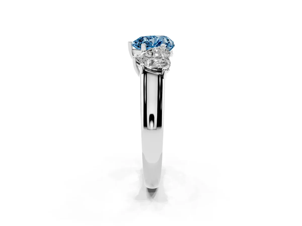 Fancy Blue Heart Cut Three-Stone Diamond Ring with Prong Setting on a Classic Band Platinum