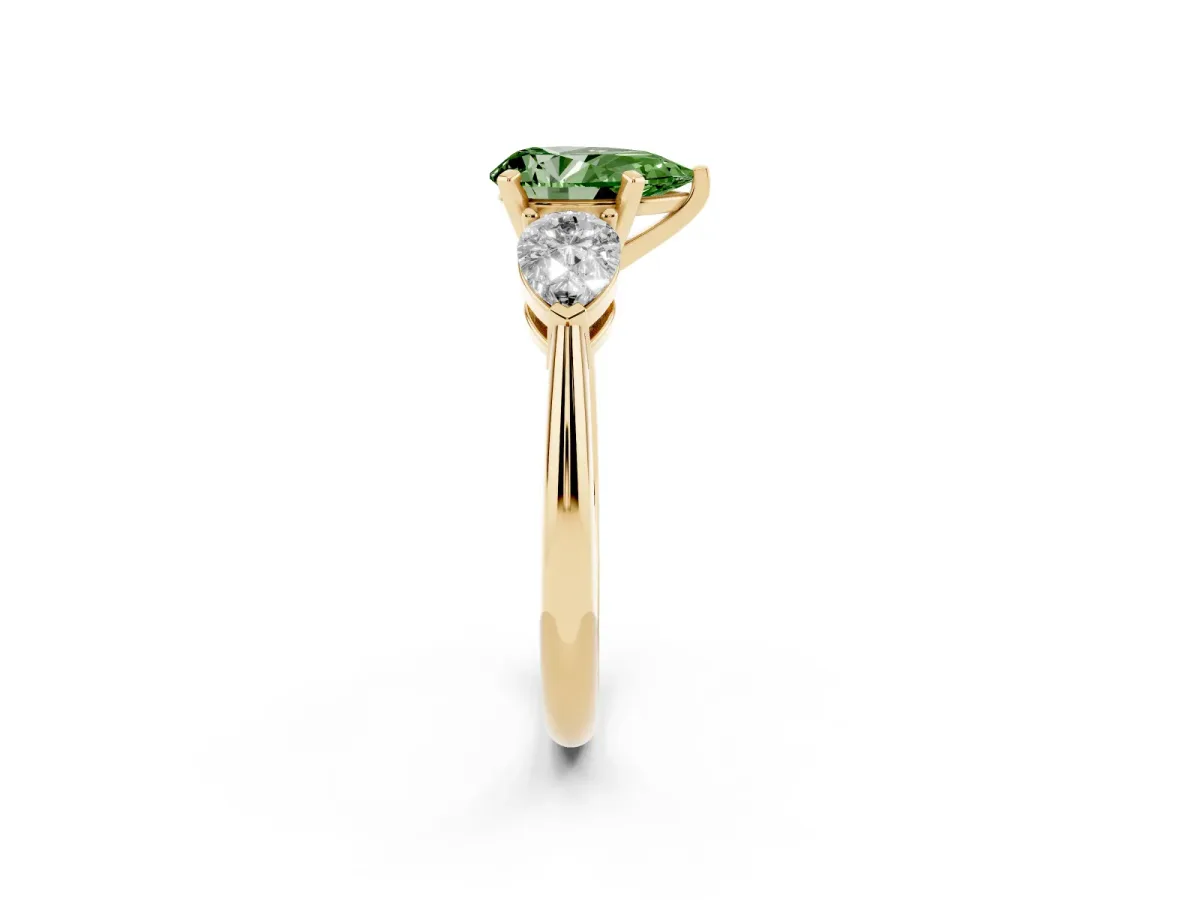 Fancy Green Three-Stone Pear Cut Diamond Ring with Pear Side Stones and Four-Prong Setting Yellow gold
