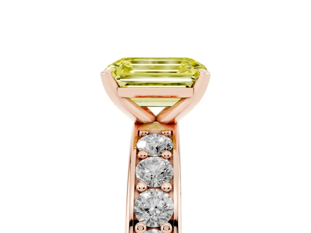 Fancy Yellow Emerald Cut Diamond Engagement Ring with Channel Set Round Band and Prong Setting Rose gold