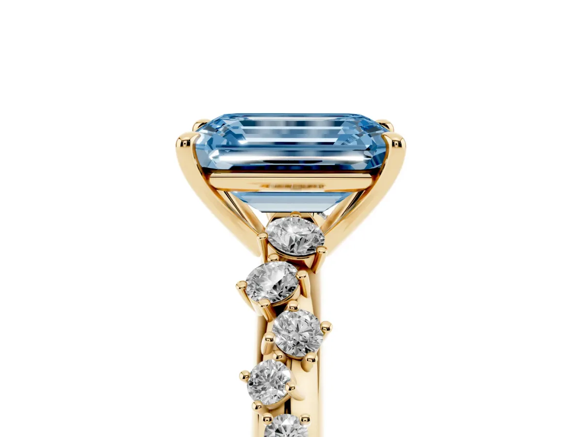 Fancy Blue Emerald Cut Diamond Cluster Side Stone Solitaire Ring with Prong Setting Yellow gold