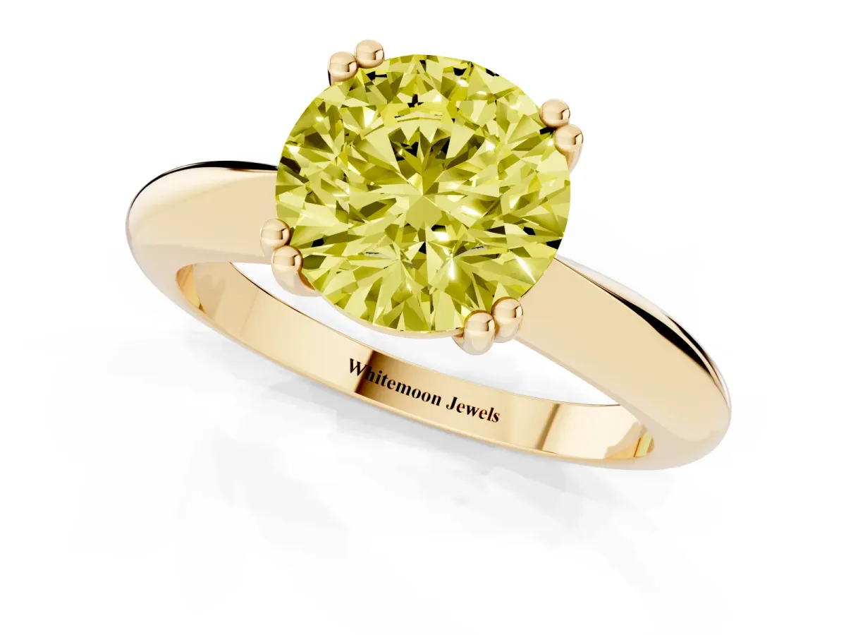 Fancy Yellow Round Cut Cut Solitaire Engagement Ring with Tapered Band and Four-Prong Setting Yellow gold