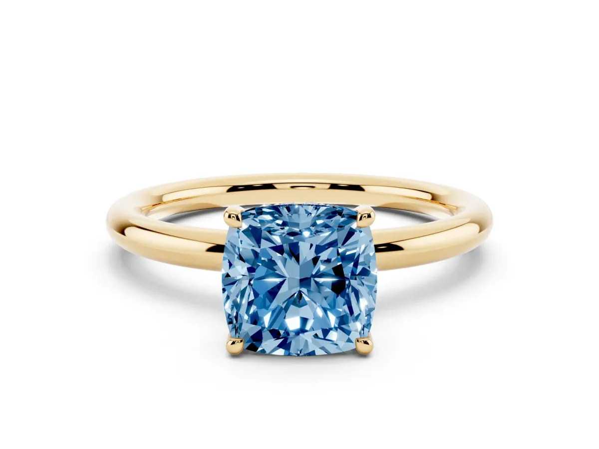 Fancy Blue Cushion Cut Diamond Solitaire Ring with Thin Band and Four-Prong Setting Yellow gold