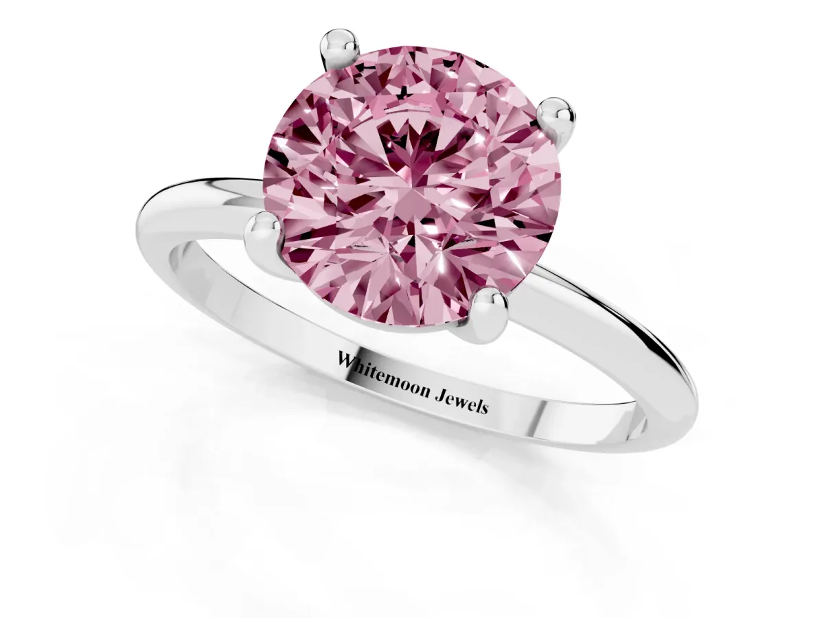 Fancy Pink Round Cut Solitaire Diamond Ring with 4-Prong Setting on a Classic Band Platinum