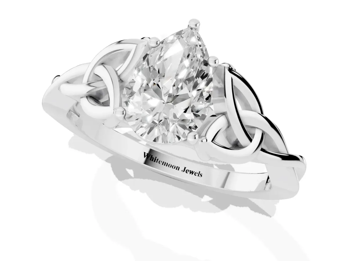 Pear Cut Diamond Solitaire Engagement Ring with Celtic Knot Band and Four-Prong Setting White gold