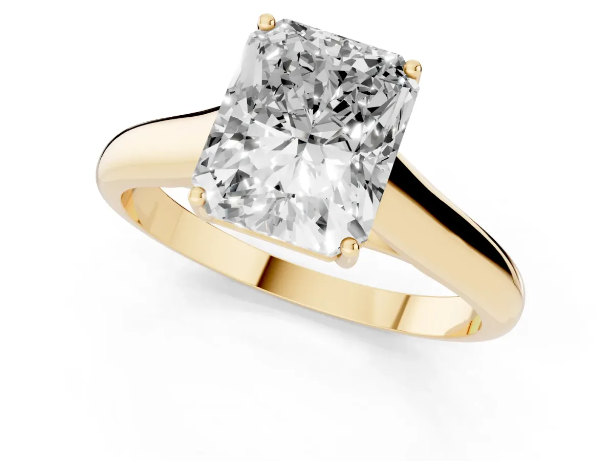 Radiant Cut Solitaire Engagement Ring with Tapered Band and Four-Prong Setting Yellow gold