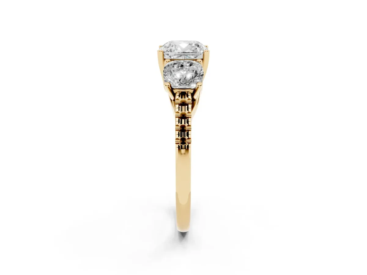 Three-Stone Cushion Cut Diamond Ring with Round Pavé Band and Prong Setting Yellow gold