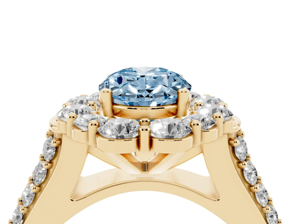 Fancy Blue Oval Cut Halo Diamond Engagement Ring with Split Shank and Prong Setting Yellow gold