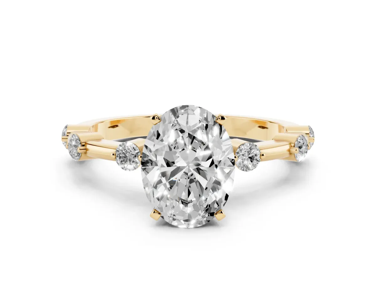 Oval Cut Solitaire Diamond Ring with Bezel Set Side Stones and Prong Setting Yellow gold