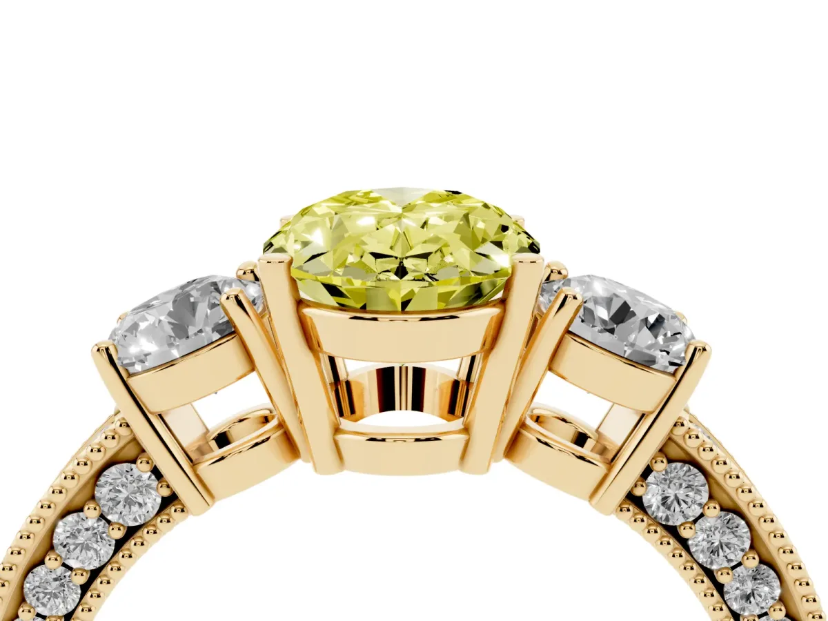 Fancy Yellow Oval Cut Three-Stone Diamond Ring with Pavé Band and Four-Prong Setting Yellow gold