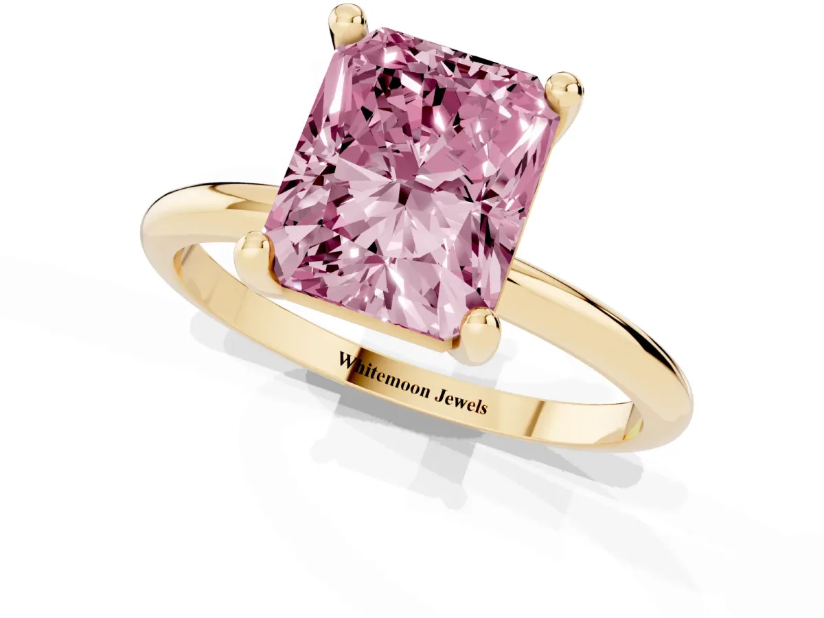 Fancy Pink Radiant Cut Solitaire Diamond Ring with 4-Prong Setting on a Classic Band Yellow gold