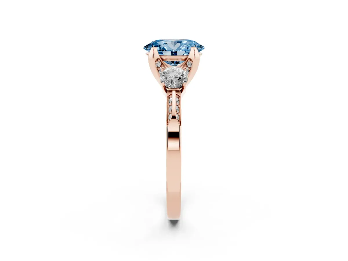 Fancy Blue Oval Cut Brilliant Three-Stone Diamond Ring with Pavé Band and Four-Prong Setting Rose gold