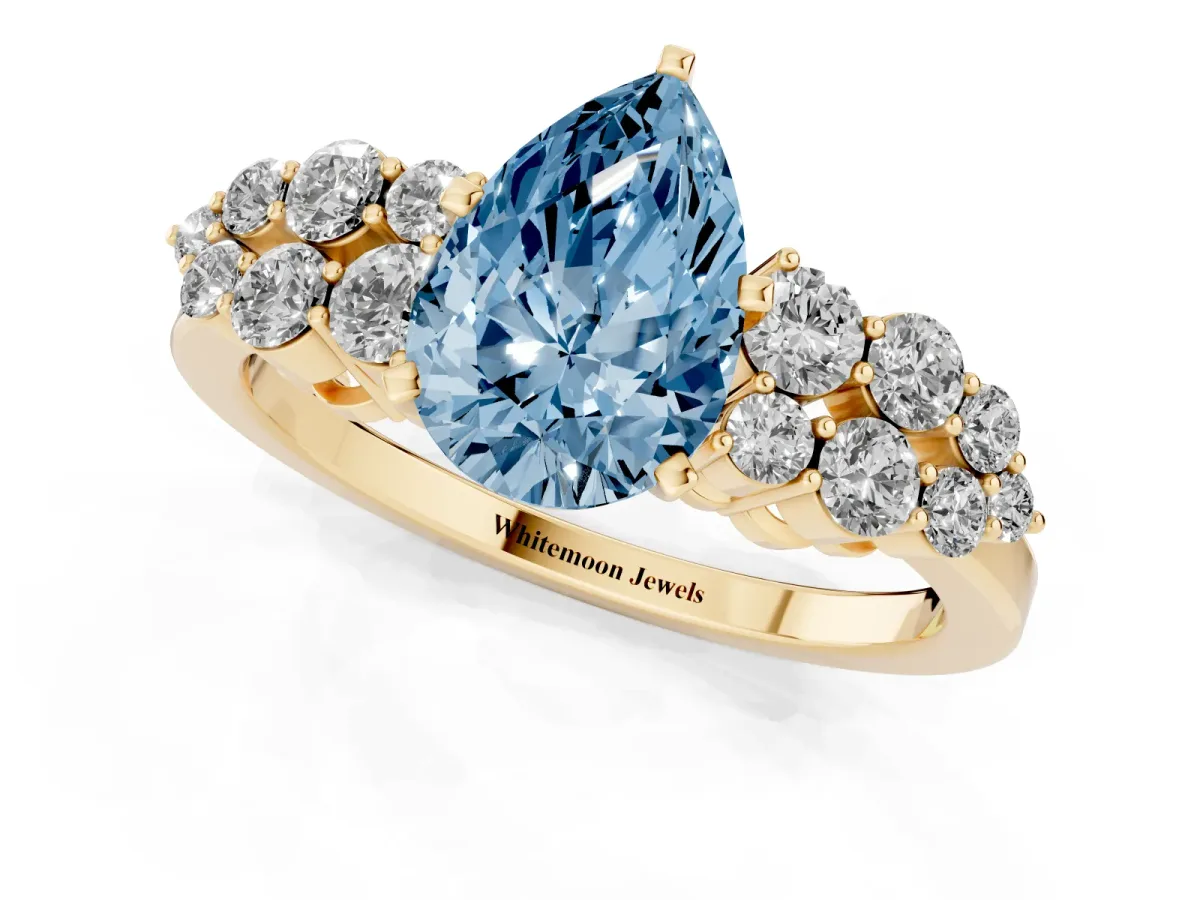 Fancy Blue Pear Cut Cluster Diamond Engagement Ring with Pavé Band and Four-Prong Setting Yellow gold