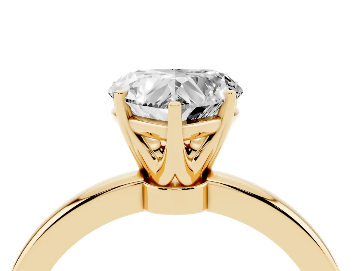 Heart Cut Solitaire Diamond Ring with Six-Prong Setting on a Classic Band Yellow gold