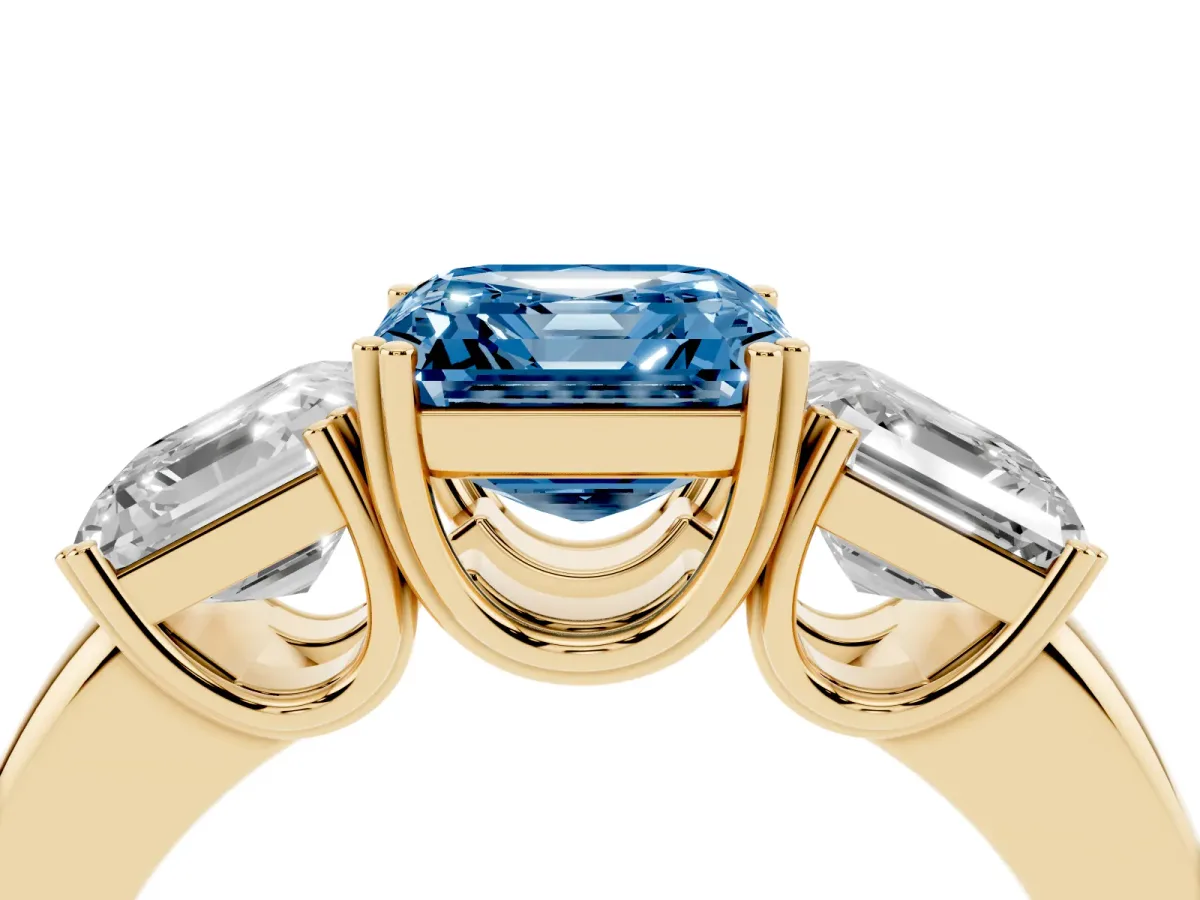 Fancy Blue Three-Stone Asscher Cut Cut Diamond Ring with Channel Set Band and Four-Prong Setting Yellow gold